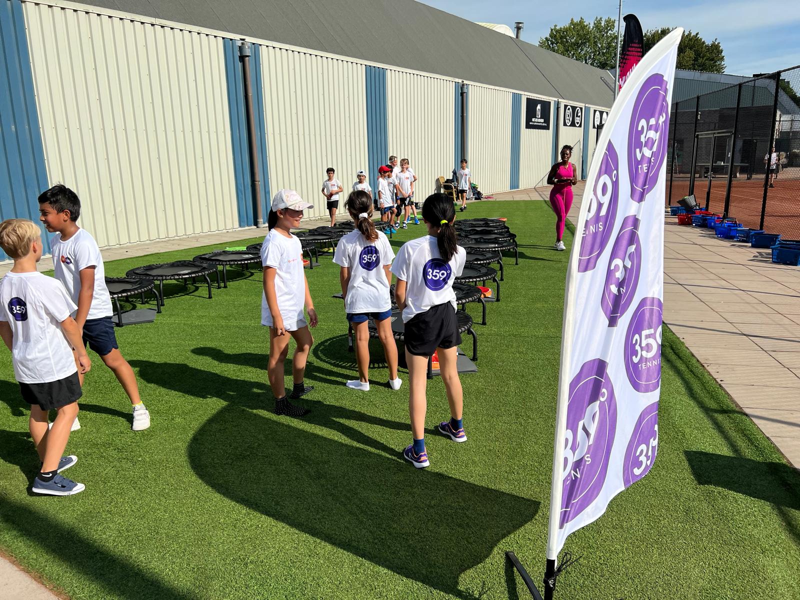 Trampoline session beside the tennis courts – 359 tennis camp Amstelveen