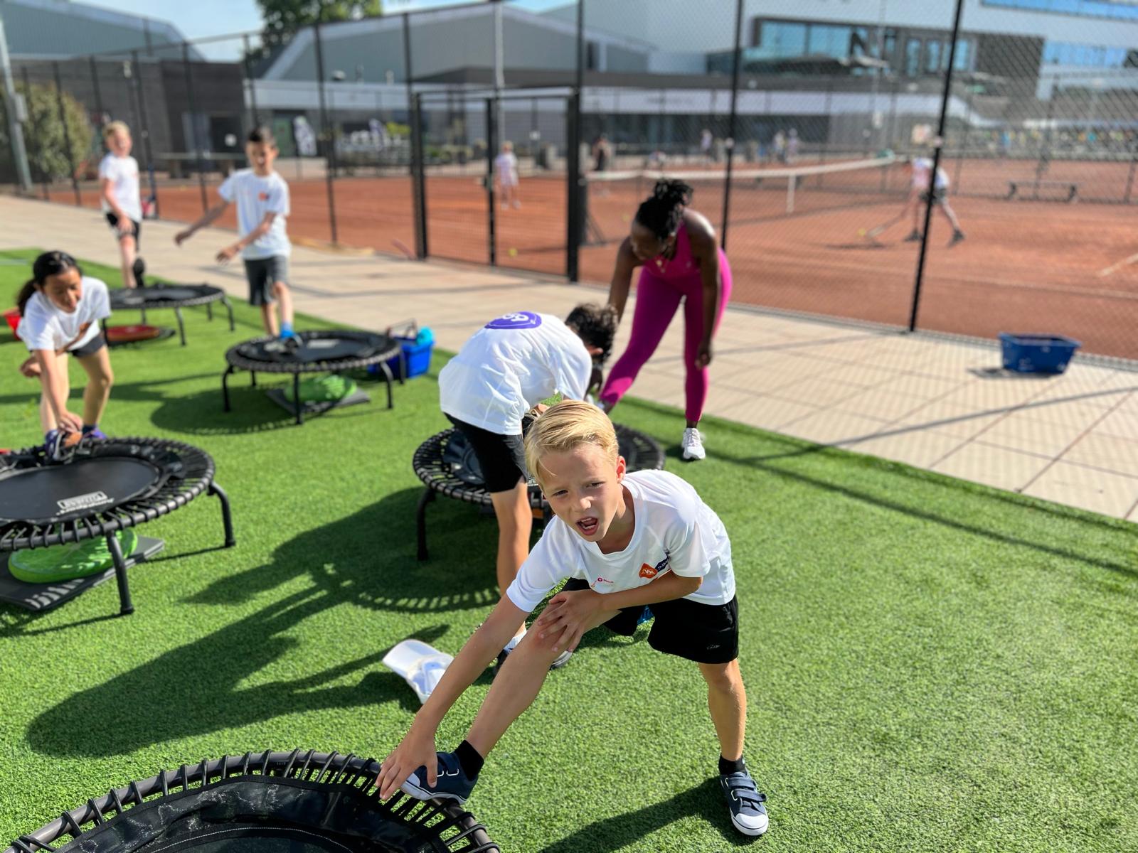 Warming up beside the trampolines – 359 tennis camp Amstelveen