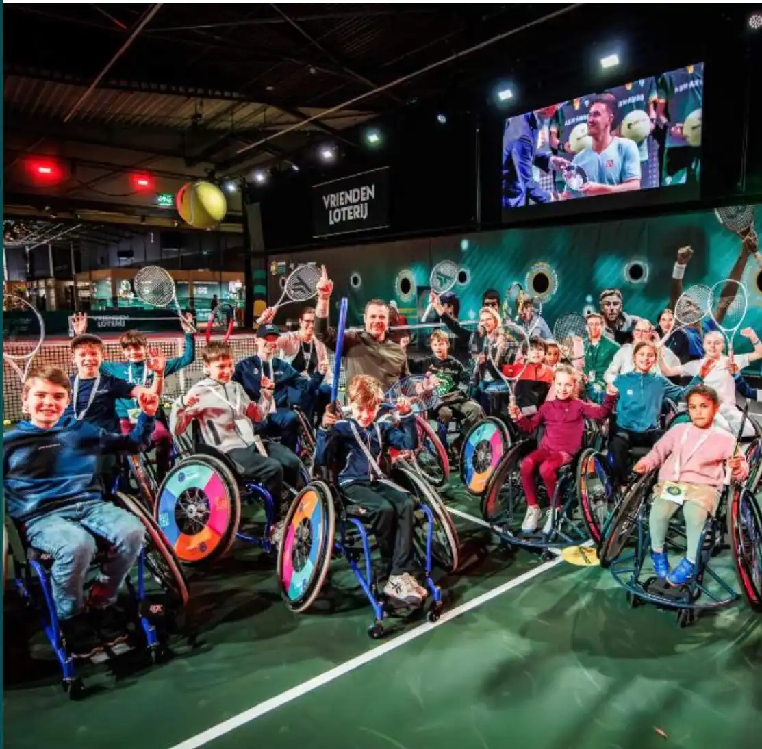 Group photo of children at the wheelchair tennis clinic during the ABN AMRO OPEN
